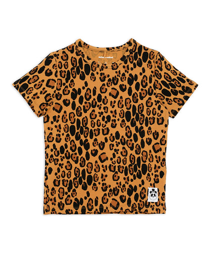 Mini Rodini beige Leopard print all over t-shirt with short sleeves and a round neckline. the leopard print is on a beige  background with darker brown and black leopard spots