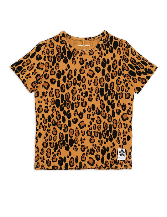 Mini Rodini beige Leopard print all over t-shirt with short sleeves and a round neckline. the leopard print is on a beige  background with darker brown and black leopard spots