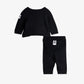 Black baby sweater and pants set on a white background