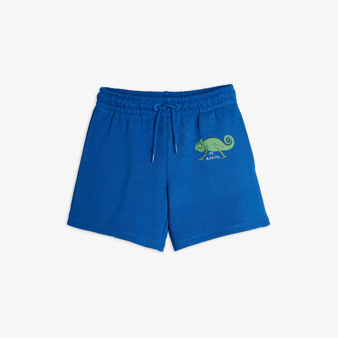 Bright blue Mini Rodini sweatshorts featuring a playful green chameleon print on the left leg. Designed with an elasticated drawstring waistband for comfort.