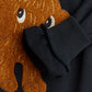 Black sweater with a brown mammoth patch on a plain background