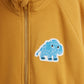 Yellow jacket with a blue and white mammoth patch on the chest