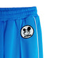 Blue pants with a black and white logo on a white background