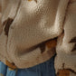Close-up of Konges Sløjd Magot Pants in Lemon Denim and Jody Teddy Jacket – A cosy-textured teddy fleece meets soft blue denim adorned with delicate lemon prints. Thoughtfully designed for little explorers who love comfort with a touch of playful charm.
