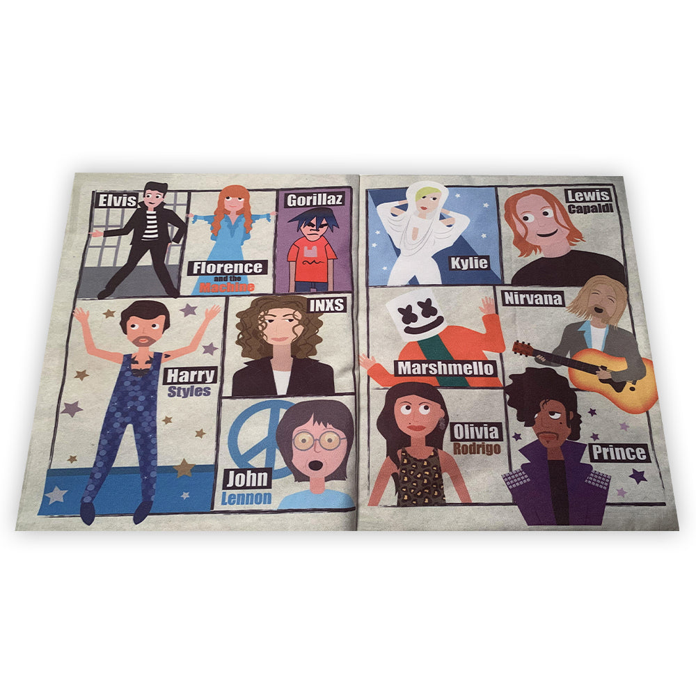 A colourful cloth book designed to look like a crinkly newspaper. The book features six brightly illustrated pages showcasing popular music artists, with crinkly texture and soft fabric. It is presented on a neutral background, emphasizing its lightweight and sensory appeal for babies and toddlers. A spread inside shows Elvis, Florence and the Machine, Gorillas, Harry Styles, INXS, John Lennon, Kylie, Lewis Capaldi, Marshmello, Nirvana, Olivia Rodrigo, and Prince