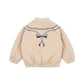 Beige children's jacket with a bow design on a white background