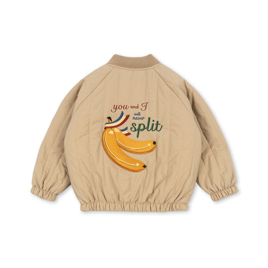Beige jacket with banana graphic and text on a white background