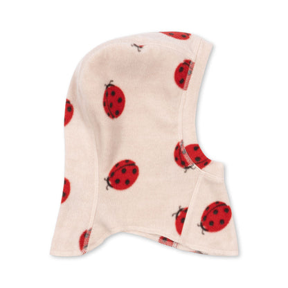 Beige fleece balaclava with red ladybug pattern on a white background