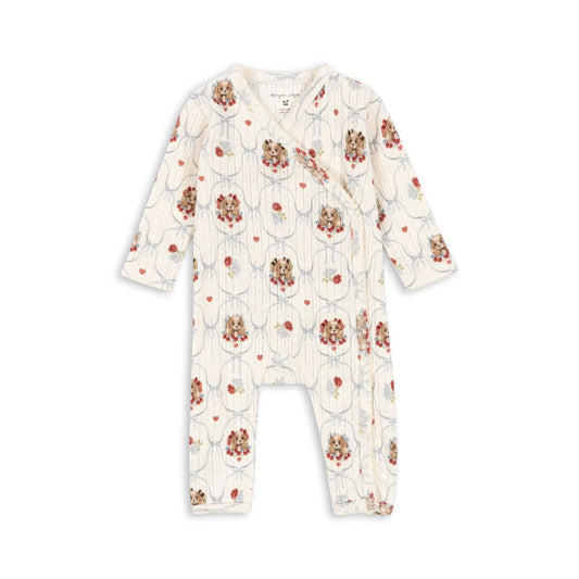 Floral patterned baby onesie on a white background