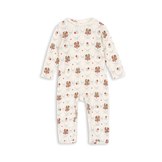 Floral patterned baby onesie on a white background