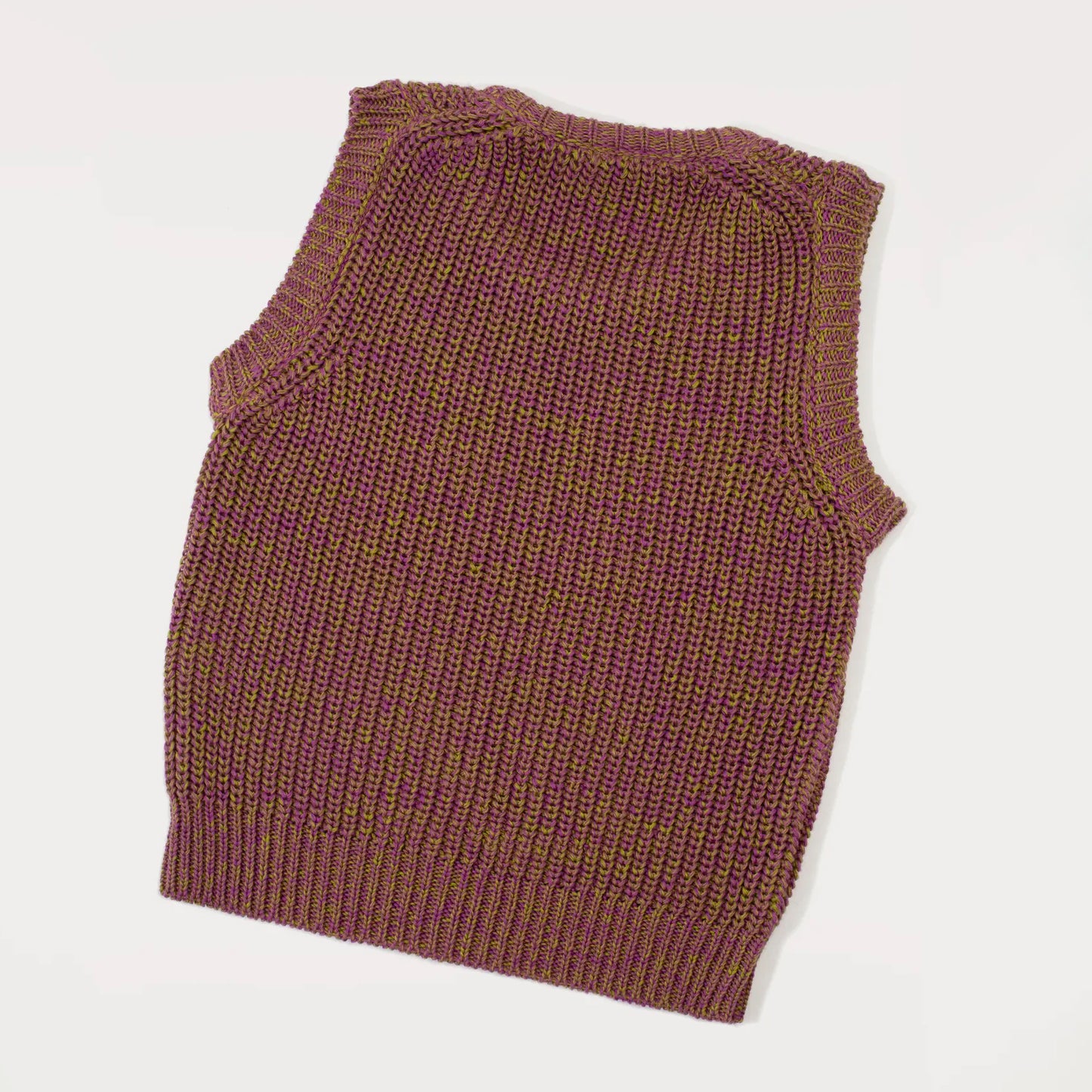 Showing the back of the Studio Koter Skye Knitted Vest in a chunky half-cardigan stitch, featuring a boxy fit and round neckline. Made from soft cotton yarn in a mix of purple and olive green, creating a unique melange effect.