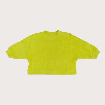 Studio Koter River Teddy Sweatshirt in vibrant acid green, featuring the soft, textured fabric of 100% organic cotton teddy fleece. The image highlights the boxy fit and kimono-style sleeves, emphasizing the unique tactile quality and curved back seam design.