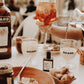 Table setting with Ricard drinks, food, and a bottle of Aperol Prosecco.