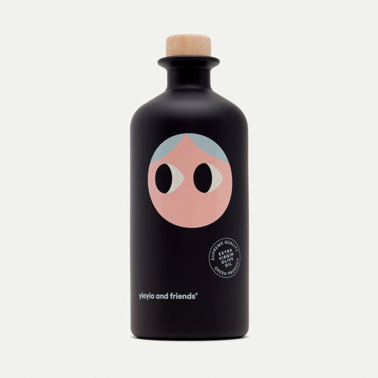 A product shot of the Yiayia and Friends Extra Virgin Olive Oil bottle against a clean, neutral background, emphasizing its sleek packaging and premium branding.