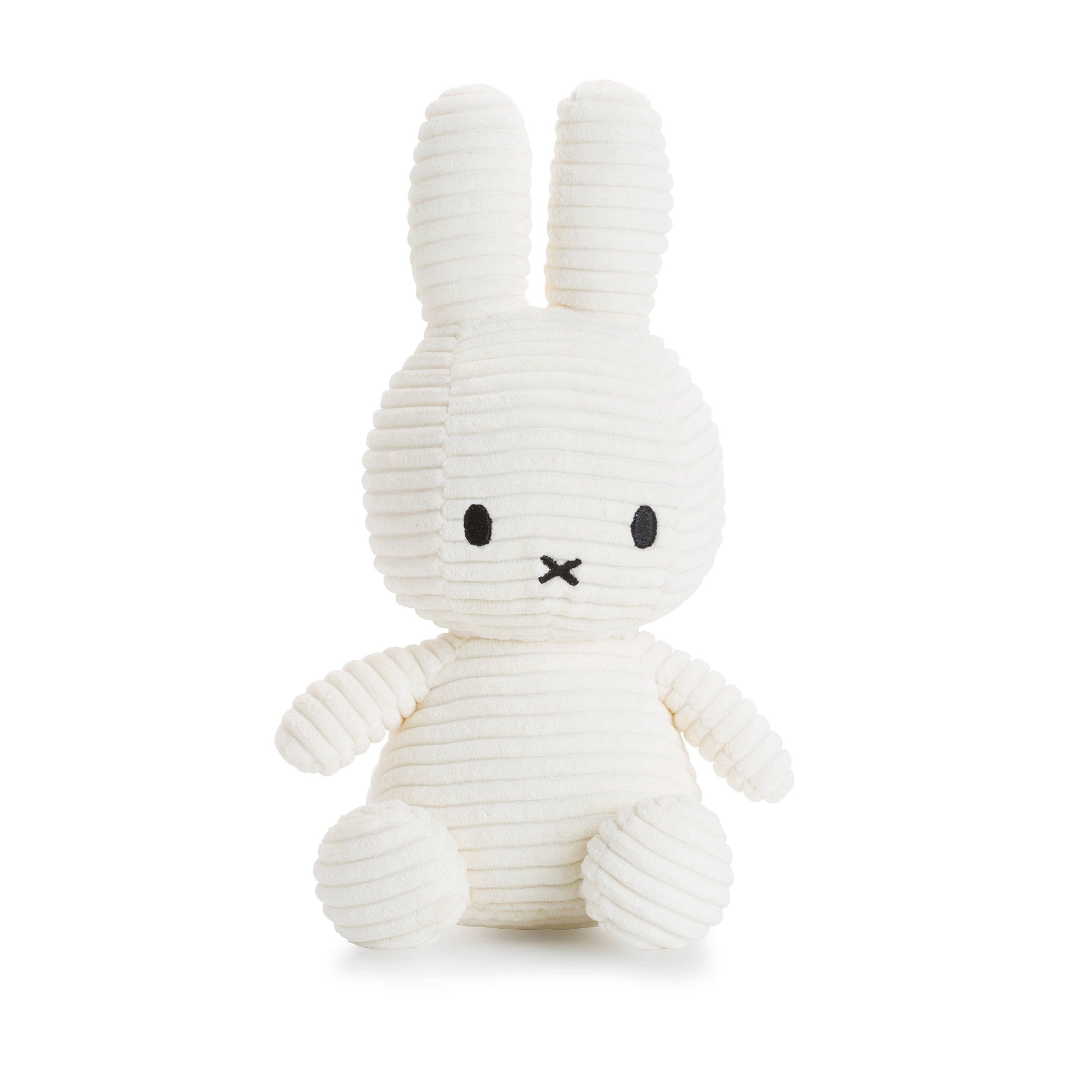 A Miffy Corduroy soft toy in the colour soft white. This Miffy has black eyes and nose. It is 23 cm in height. The background is white. 