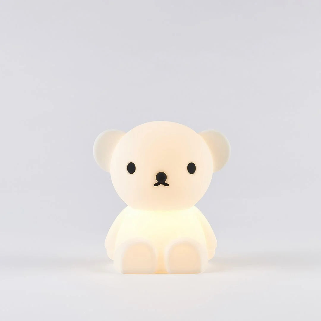 A silicone nightlight designed to look like a teddy bear with a subtle glow coming from its body.