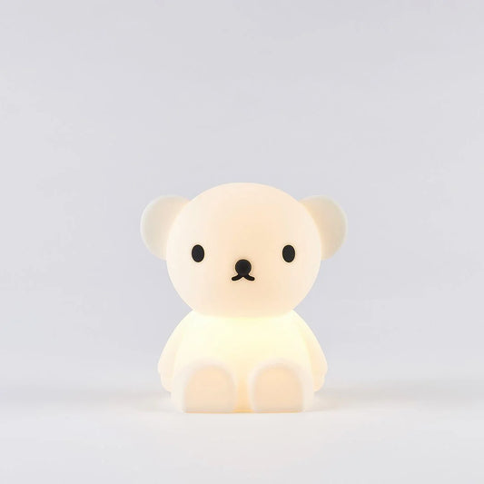 A silicone nightlight designed to look like a teddy bear with a subtle glow coming from its body.