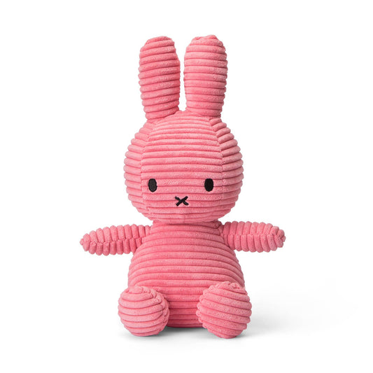 A Miffy Corduroy Bubblegum soft toy in the colour pink. This Miffy has black eyes and nose. It is 23 cm in height. The background is white. 