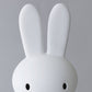 Close up of Mr Maria Miffy XL Lamp, 80 cm tall, iconic statement piece with six brightness settings, inspired by Dick Bruna's classic illustrations.