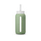 A matte Silicone covered glass bottle, with a window to see the drink on the inside, in a muted sage green colour with a plastic screw top circular lid with a handle