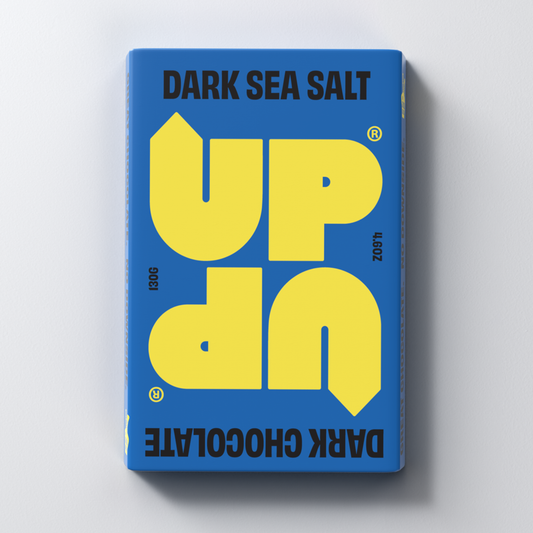 A dark sea salt chocolate bar packaging with blue and yellow design elements, prominently displaying the brand name 'UP-UP CHOCOLATE'.
