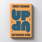 A chocolate bar packaging with the text 'SWEET ORANGE UP UP MILK CHOCOLATE' on the front.