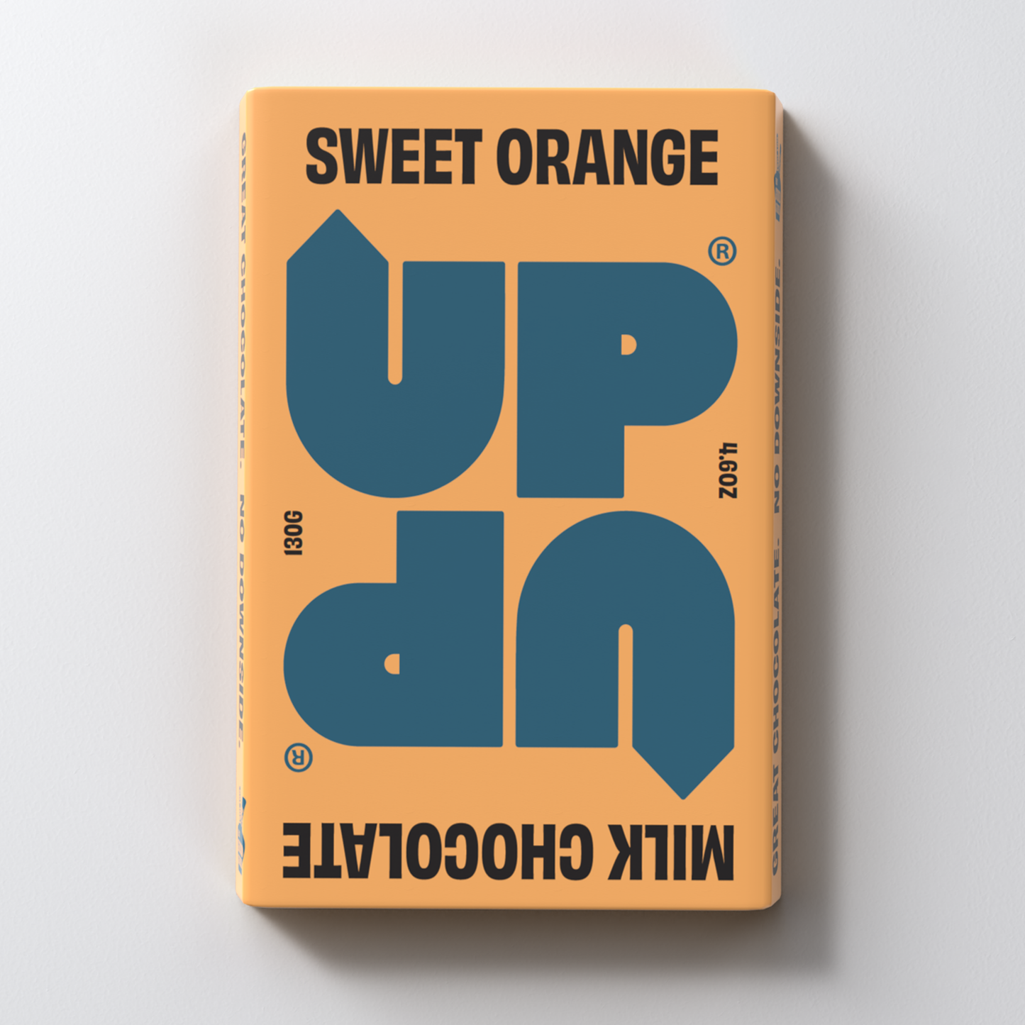 A chocolate bar packaging with the text 'SWEET ORANGE UP UP MILK CHOCOLATE' on the front.