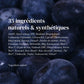 An image of the list of the 35 ingredients that are used to create this perfume, written  in French, against the backdrop of an image of blueberries. 
